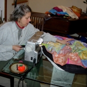 Laura Sewing the Folkshul Batik Quilts 